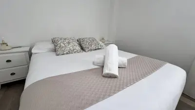 Cama o camas de una habitación en Apartamenticos Plaza del Pilar III