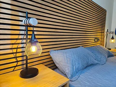 Cama o camas de una habitación en Apartamentos Escarrilla Suites 3000