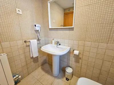 Un baño de Apartamentos Escarrilla Suites 3000