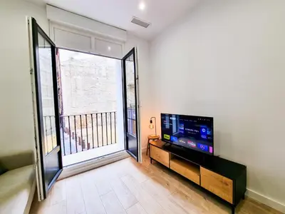 Una televisión o centro de entretenimiento en Pilar Dreams ComoTuCasa