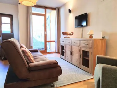 Una televisión o centro de entretenimiento en CHECK-IN CASAS Pico de las Nieves