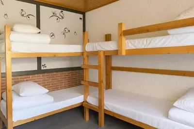 Cama o camas de una habitación en Albergue Tritón - Villanúa
