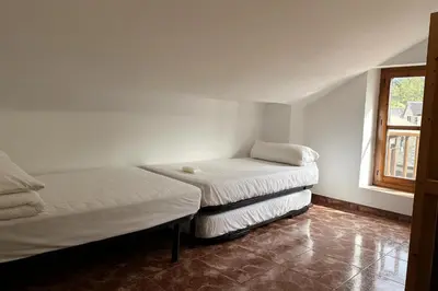 Cama o camas de una habitación en Albergue Tritón - Villanúa