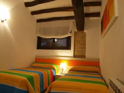 Cama o camas de una habitación en Apartamentos Berdiel