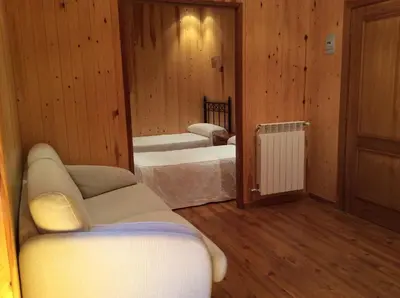 Cama o camas de una habitación en Hotel La Ribera