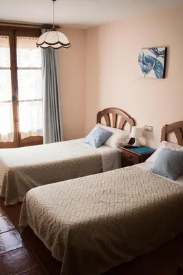 Cama o camas de una habitación en Pension Las Cuevas de Cañart