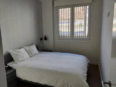 Cama o camas de una habitación en Apartamentos Ezkaba by Clabao