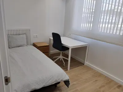 Cama o camas de una habitación en Apartamentos Ezkaba by Clabao