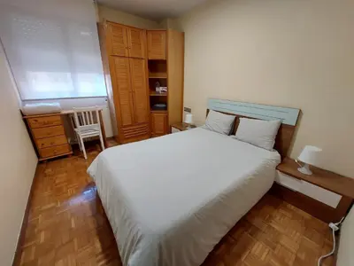 Cama o camas de una habitación en Piso sencillo y acogedor con parking gratuito