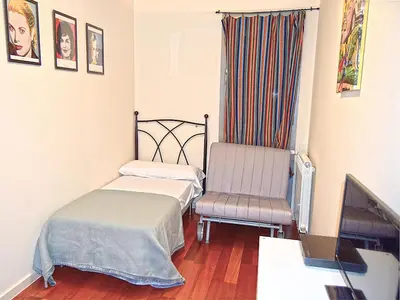 Cama o camas de una habitación en Apartamentos Las Margas Sabiñánigo 3000