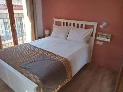 Cama o camas de una habitación en Com a casa