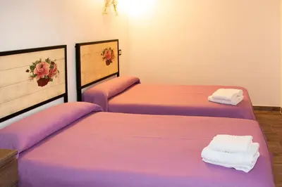 Cama o camas de una habitación en Casa rural Bisimbre