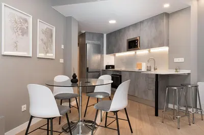 Una cocina o zona de cocina en Apartamentos Torre del Reloj