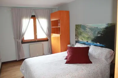 Cama o camas de una habitación en Oasis Pirineos