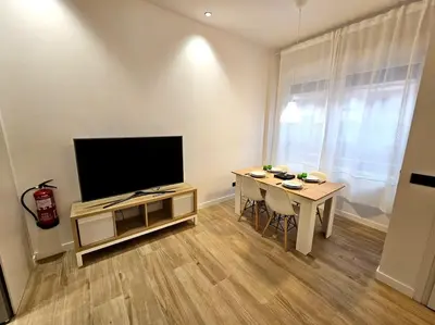 Una televisión o centro de entretenimiento en Loft céntrico y acogedor UAT01526