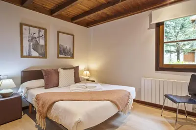 Cama o camas de una habitación en Luderna - Apto Val de Ruda B135 Era Tringòla