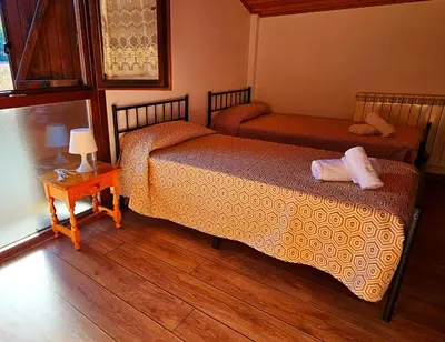 Cama o camas de una habitación en CASA COTIELLA RAÑIN