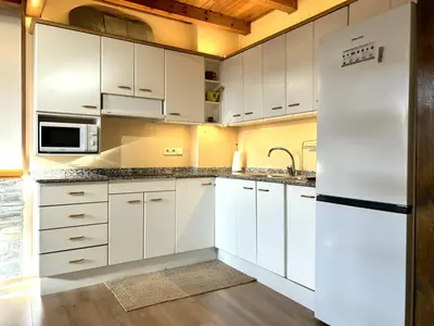 Una cocina o zona de cocina en Àtic lluminós al centre d’Esterri d'Àneu by RURAL D'ÀNEU