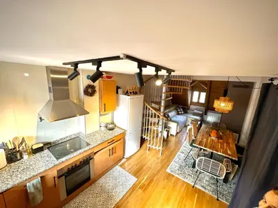 Zona de estar de Caleydos - Dúplex diseño by CARDI Suites