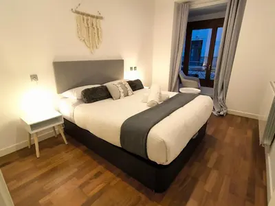 Cama o camas de una habitación en El Mirador de Alfonso I by Alogest