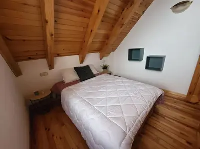 Cama o camas de una habitación en Duplex en la Vall de Boí, plena naturaza