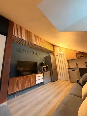 Una televisión o centro de entretenimiento en Acogedor Ático en el Corazón de Formigal - Esquía sin llaves