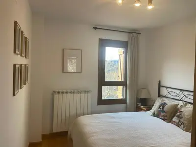 Cama o camas de una habitación en Inmocyma Cerler- Aigualluts-Pirineo en familia