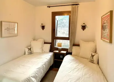 Cama o camas de una habitación en Inmocyma Cerler- Aigualluts-Pirineo en familia