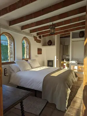 Cama o camas de una habitación en Casa Hostalets - Renovated casa in the middle of the olive trees near the beach