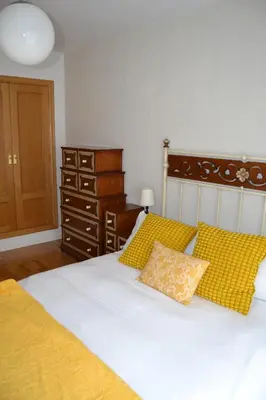 Cama o camas de una habitación en Ventanal de Saras Petfriendly Garaje Trastero y Chimenea - Arafita Apartamentos