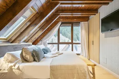 Cama o camas de una habitación en Luderna - Tríplex Val de Ruda C305