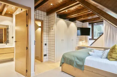 Cama o camas de una habitación en Luderna - Tríplex Val de Ruda C305