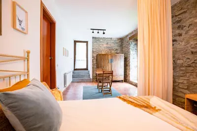 Cama o camas de una habitación en El Molino de Castiello de Jaca
