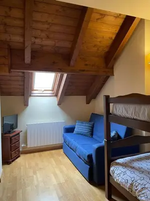 Cama o camas de una habitación en Apartamento dúplex en Benasque