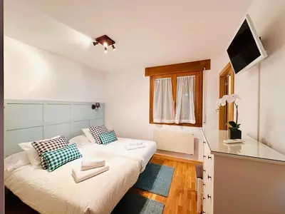 Una televisión o centro de entretenimiento en Apartamento La Larri