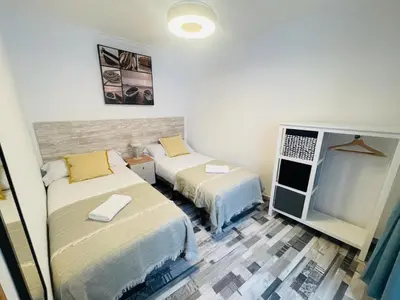 Cama o camas de una habitación en Fabuloso en el corazón de la ciudad y con garaje