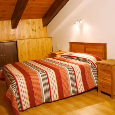 Cama o camas de una habitación en Apartamentos Angelus Plaza Mayor de Graus