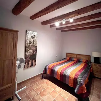 Cama o camas de una habitación en Apartamentos Angelus Plaza Mayor de Graus