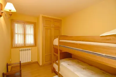 Cama o camas de una habitación en Apartamentos El Rincón de Benás