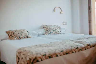 Cama o camas de una habitación en Hostal Restaurant Mussons Vins