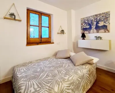 Cama o camas de una habitación en Encantador Apartamento en Pla de l’Ermita