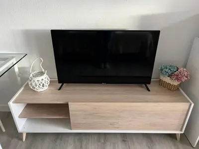 Una televisión o centro de entretenimiento en Pensión Luzía - Optional Auto Check-in