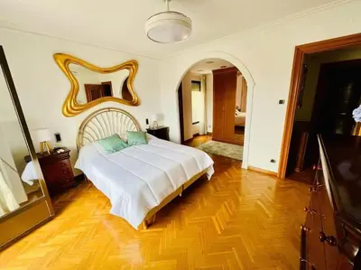 Cama o camas de una habitación en A Orillas del Pilar con parking