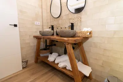 Un baño de Apartamentos La Escapada