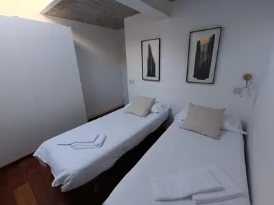 Cama o camas de una habitación en Inmocyma Los Escuadros-Benasque