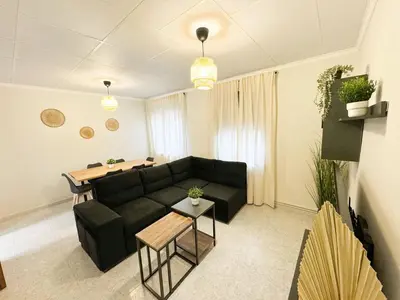 Zona de estar de La Paloma del Pilar - Turistea Suites
