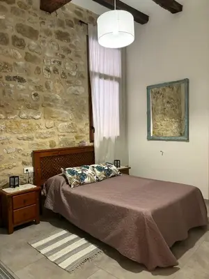 Cama o camas de una habitación en La Fusteria d' Arnes
