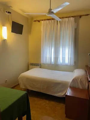 Cama o camas de una habitación en Hostal El Corzo