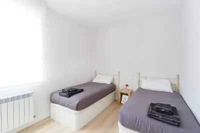 Cama o camas de una habitación en Bonito acogedor apartamento en centro de Pamplona