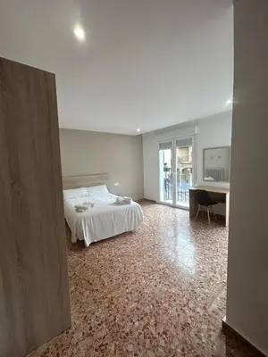 Cama o camas de una habitación en Pensión Arnedo